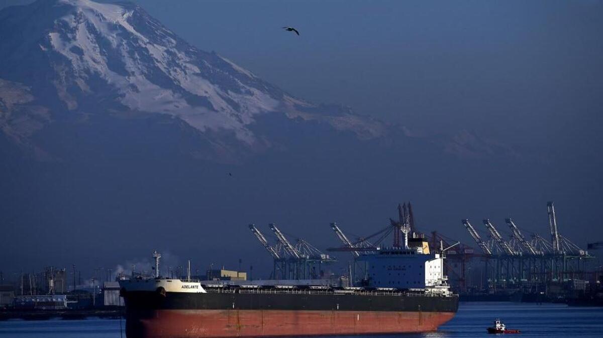 Mount Rainier towers over the Port of Tacoma. The fall is typically the busy season for shipments, but this November was especially busy.