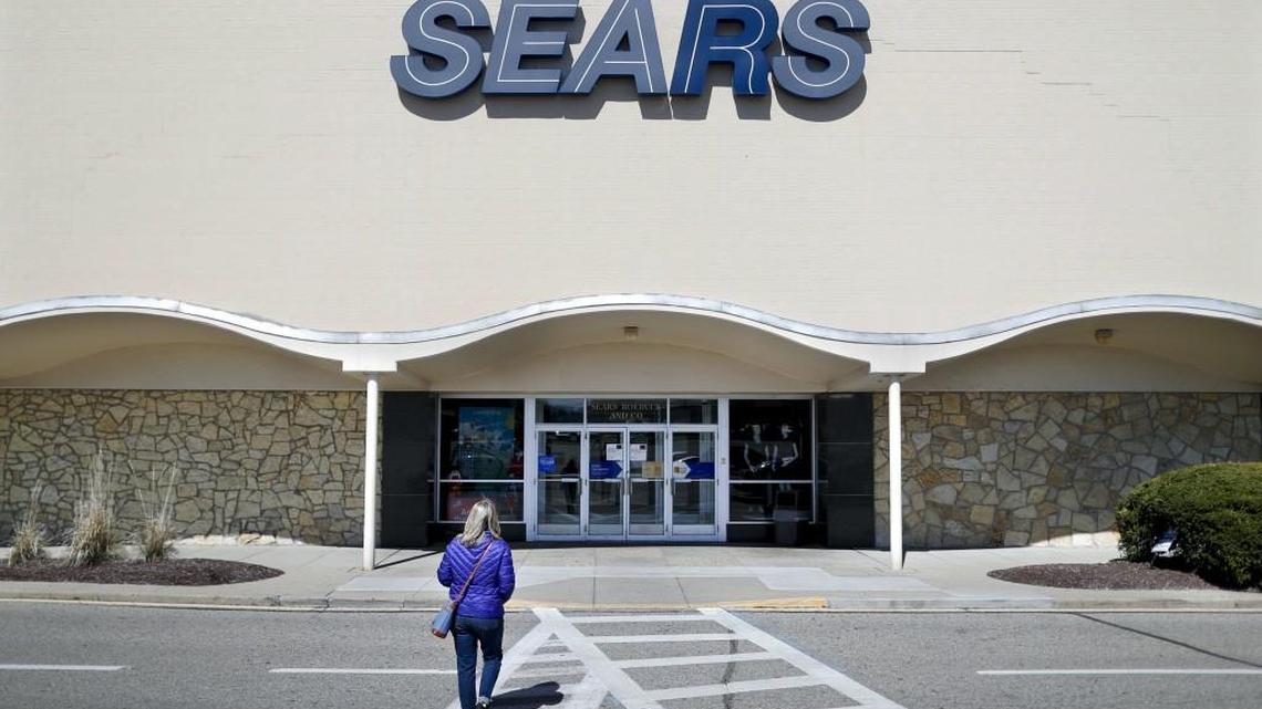 A shopper walks up to a Sears department store at the Tri-County Mall, in Springdale, Ohio. The retailer announced the closure of another round of stores, this time affecting Federal Way, Shoreline and Chehalis, which is also losing a Kmart.