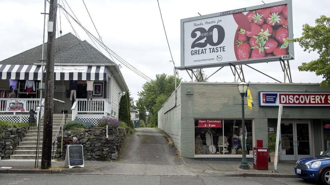 The developers of Proctor Station are planning a second mixed-use building across from the Metropolitan Market at the corner of North 25th and North Proctor Streets. The businesses pictured at left are Sonja Clothes To Live In and Proctor Frozen Yogurt. The alley at right is the cut-off of the project’s footprint.