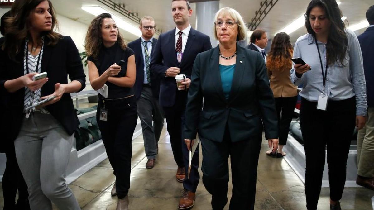 Sen. Patty Murray, D-Wash., second from right, is surrounded by reporters as she heads to a vote in Washington. Veteran service organizations have worked closely with Murray (D-Wash.) to shape caregiver expansion and gain the support of her colleagues on the House Veterans Affairs Committee.