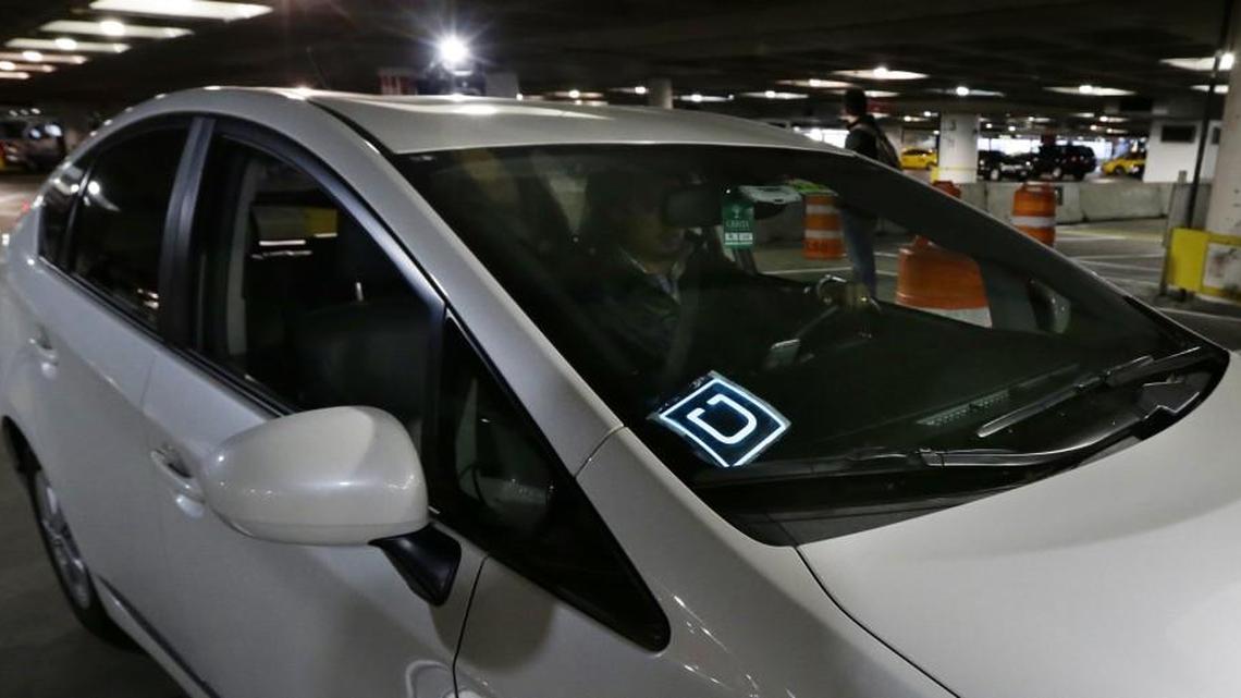 A driver for Uber Technologies Inc. arrives at an authorized customer pickup area at Seattle-Tacoma International Airport, in Seattle last year. The number of license applications received by the city of Tacoma from January through March — 863 — surpasses licenses granted in 2015, the first full year Uber and Lyft were regulated in Tacoma