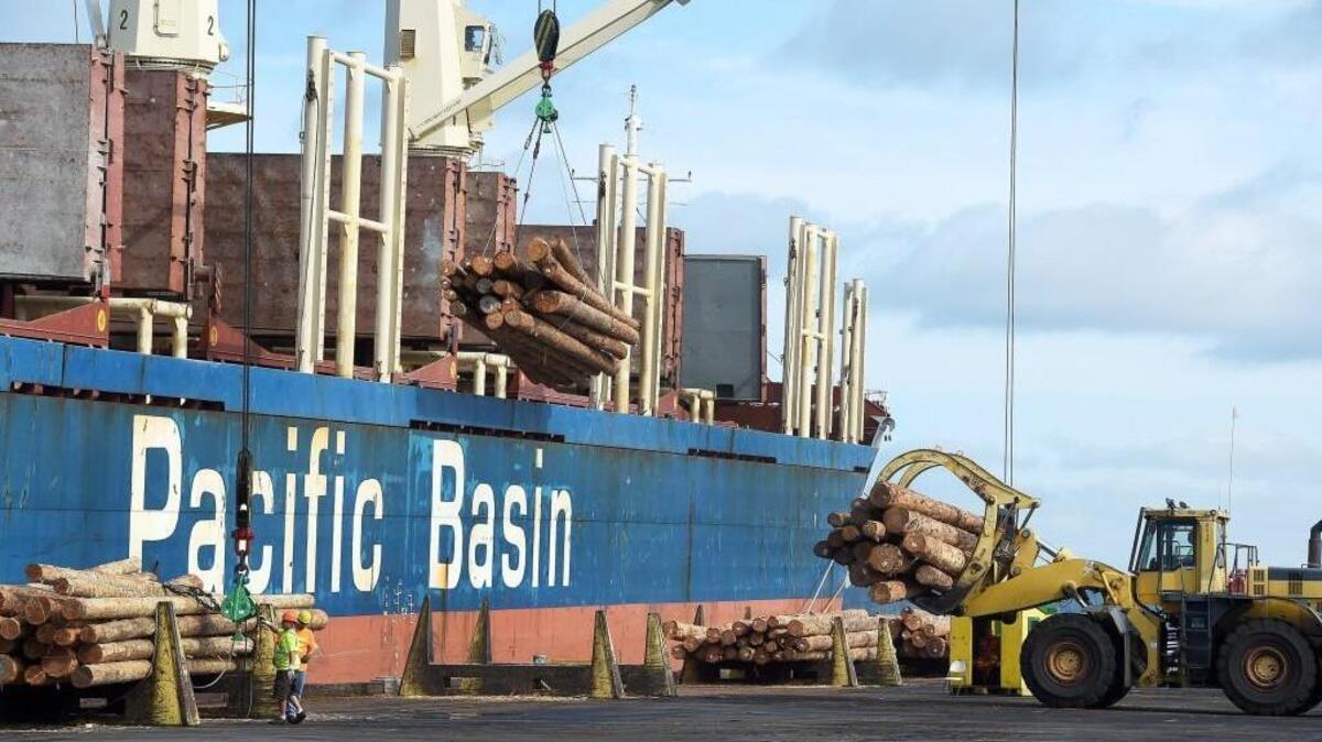 Weyerhaeuser logs destined for Lianyungang, China, are loaded onto the cargo ship Sun Ruby in August at the Port of Olympia. International markets and trends are a big temblor the Washington and Puget Sound regional economies will face this year.