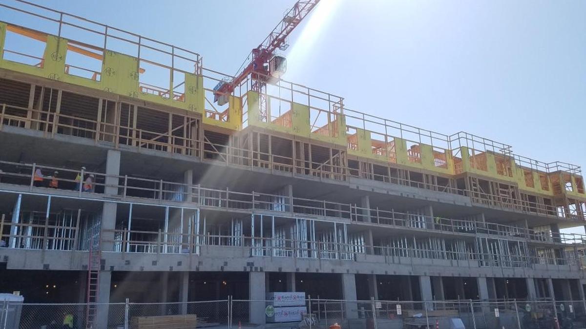 Construction on $43 million Stadium Apartments building is well under way in the Stadium District, across from Stadium Thriftway. Residents could begin moving in to the eight-story, 172-unit building next year.
