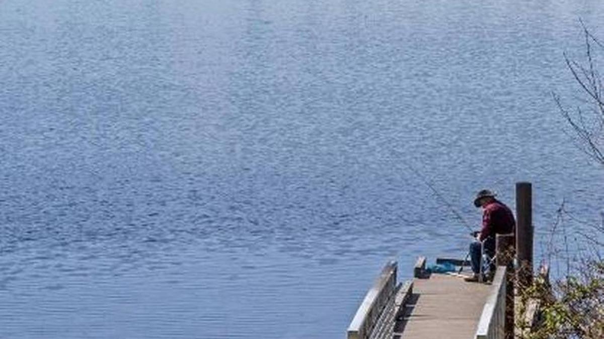 File photo of a fisherman at Lake Kapowsin from March 31, 2017.