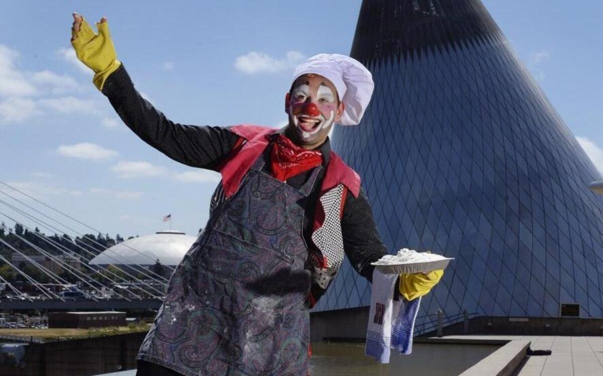 Justin Wright poses with a pie for a photo at Tacoma’s Museum of Glass in 2014. The Olympia man, better known as Jusby the Clown, believes the purpose of his career is “to entertain, to educate and to ease suffering.” Scaring people for sport does not fall into that.