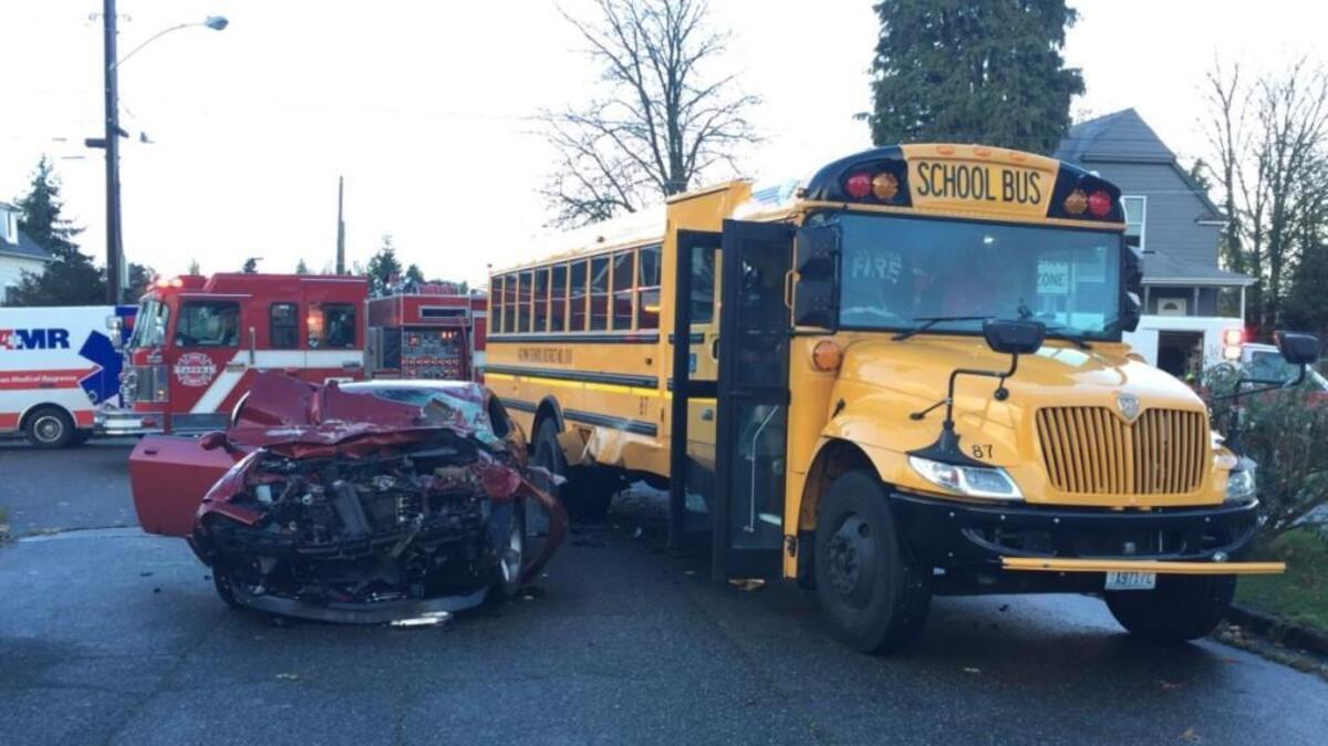 A car drove into the side of a school bus Monday morning in Tacoma.