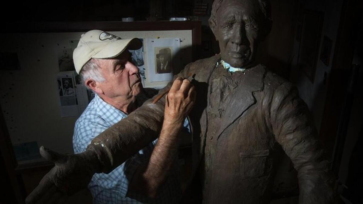 Jim Stafford, a Lewis County sculptor, adds detail to the model of George Washington, Centralia’s founder. Stafford had only four photos of Washington for reference. “When you do something like this,” he said, “you seem like you get to know them. You’re absorbing them in a sense. What they’re all about and how they think and what they do. I’ve spent most of the year reading about him and then digging into him.”
