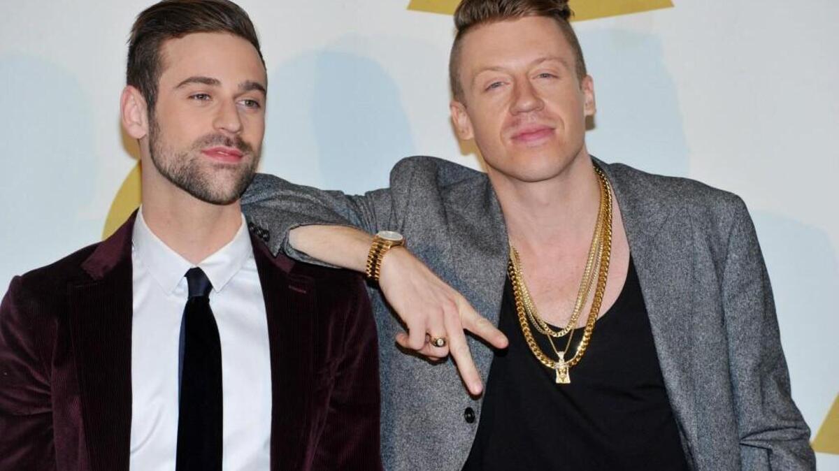 Ryan Lewis, left, and Macklemore pose backstage at the Grammy Nominations Concert Live! on Friday, Dec. 6, 2013, at the Nokia Theatre L.A. Live in Los Angeles. (Photo by Richard Shotwell/Invision/AP)