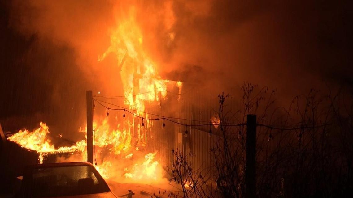 Tacoma firefighters work to knock down a blaze Wednesday night in the 3600 block of North Waterview Street.