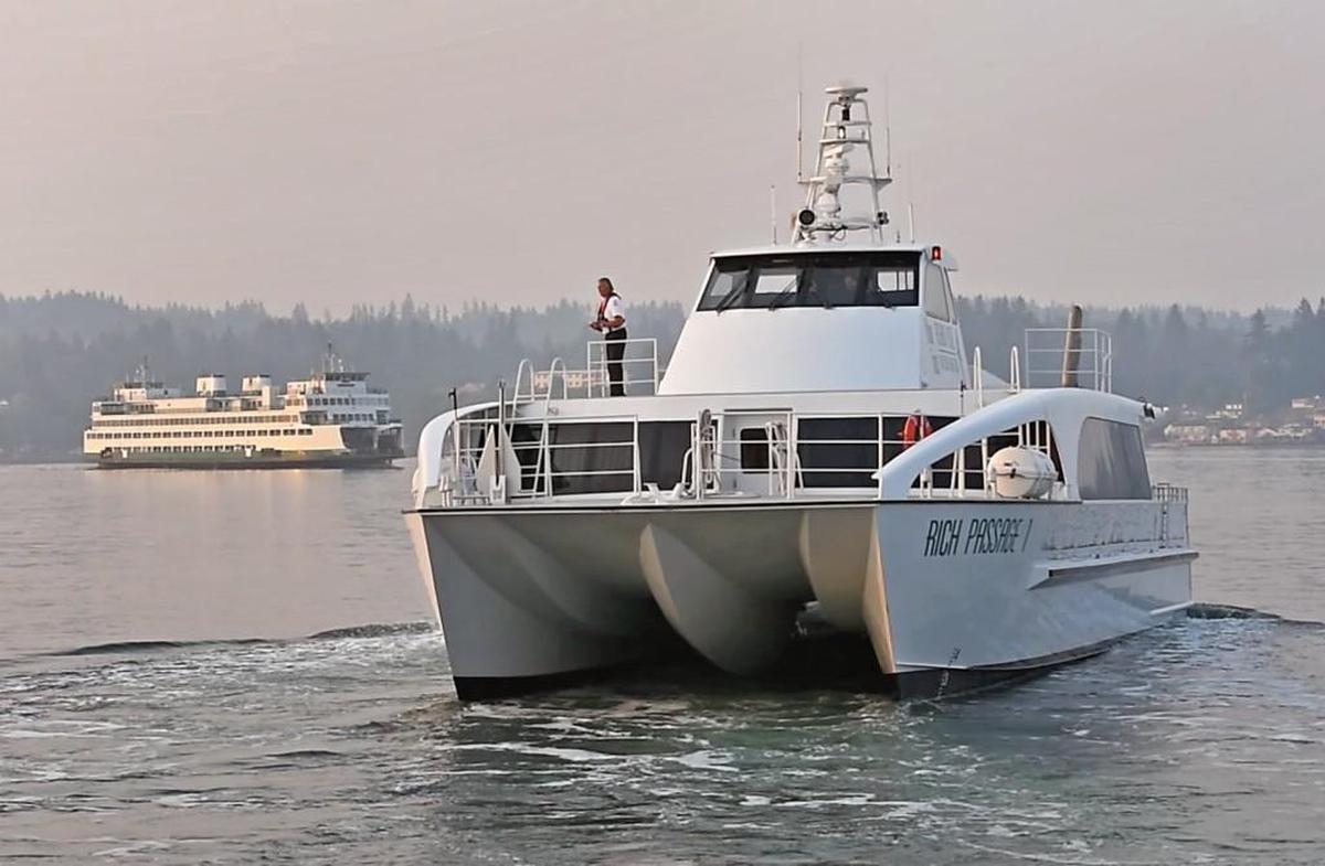 A trip from Bremerton to Seattle on Kitsap Transit’s new fast ferry typically takes about 28 minutes compared to about an hour on a Washington State ferry, background. The fast ferry features a hydrofoil design that reduces drag. Photo taken on on Thursday, Aug. 3, 2017.