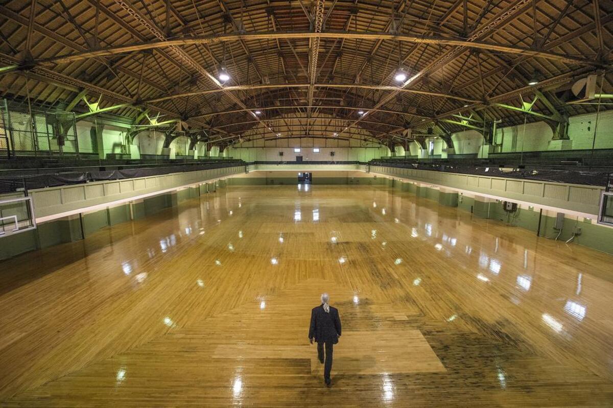 Scott Painter, Director of Operations for the Broadway Center, is dwarfed by the cavernous space of the drill hall in Tacoma’s historic Armory building.