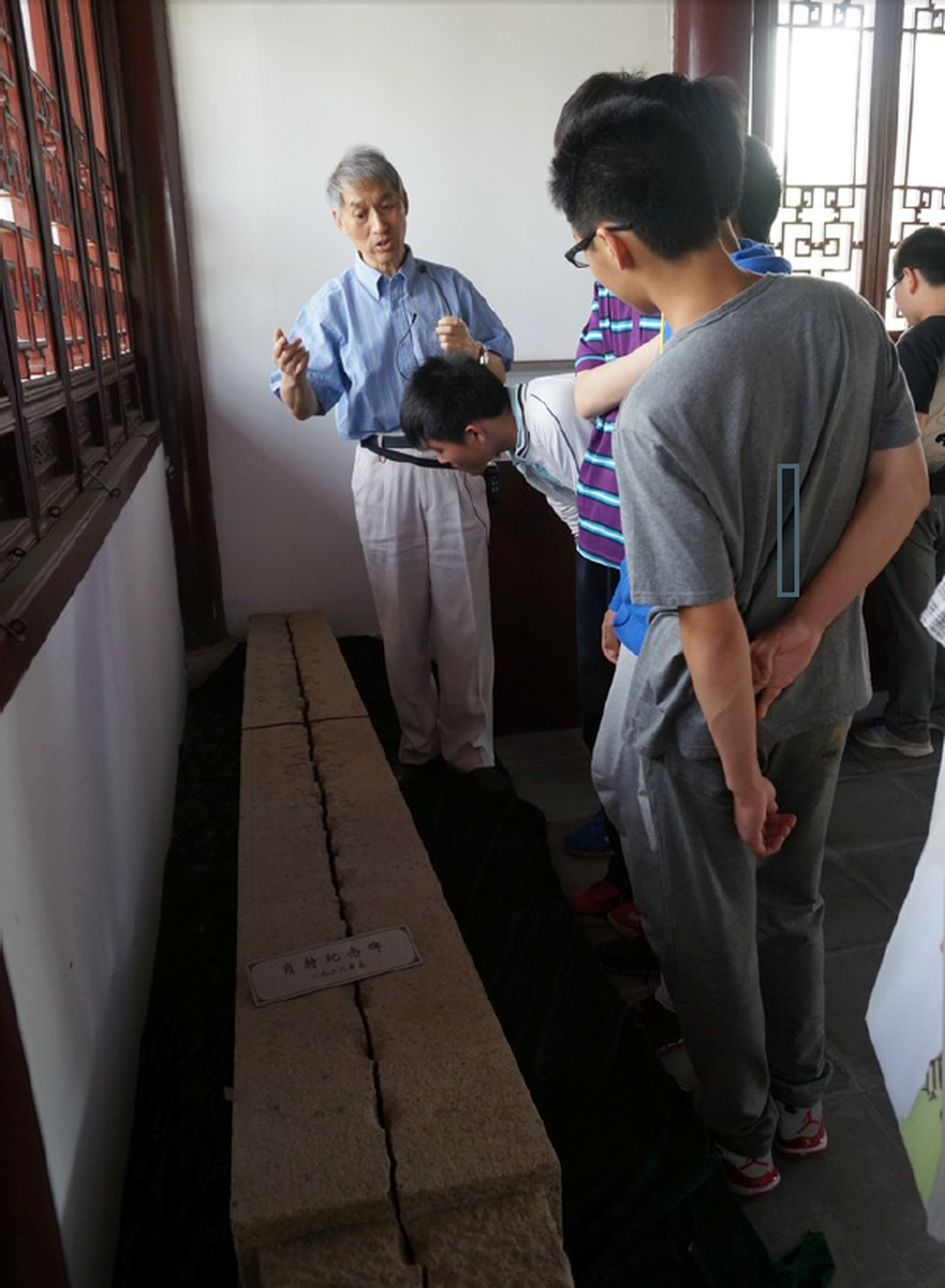 Visitors look at an obelisk inside a memorial hall built in 2009 to honor Tacoma pilot Robert Short in Chefang Town, Suzhou China. Short was shot down over China in 1932. The obelisk marked the spot where Short’s plane crashed. It was later turned into fence posts during the Cultural Revolution.