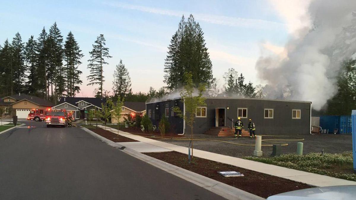 The roof smokes of a construction office building at 153 Street East and 189th Avenue East in Bonney Lake’s Tehaleh planned residential community. East Pierce Fire and Rescue crews were able to put the fire out quickly Monday morning, May 30, 2016. The Pierce County Fire Marshal is investigating.