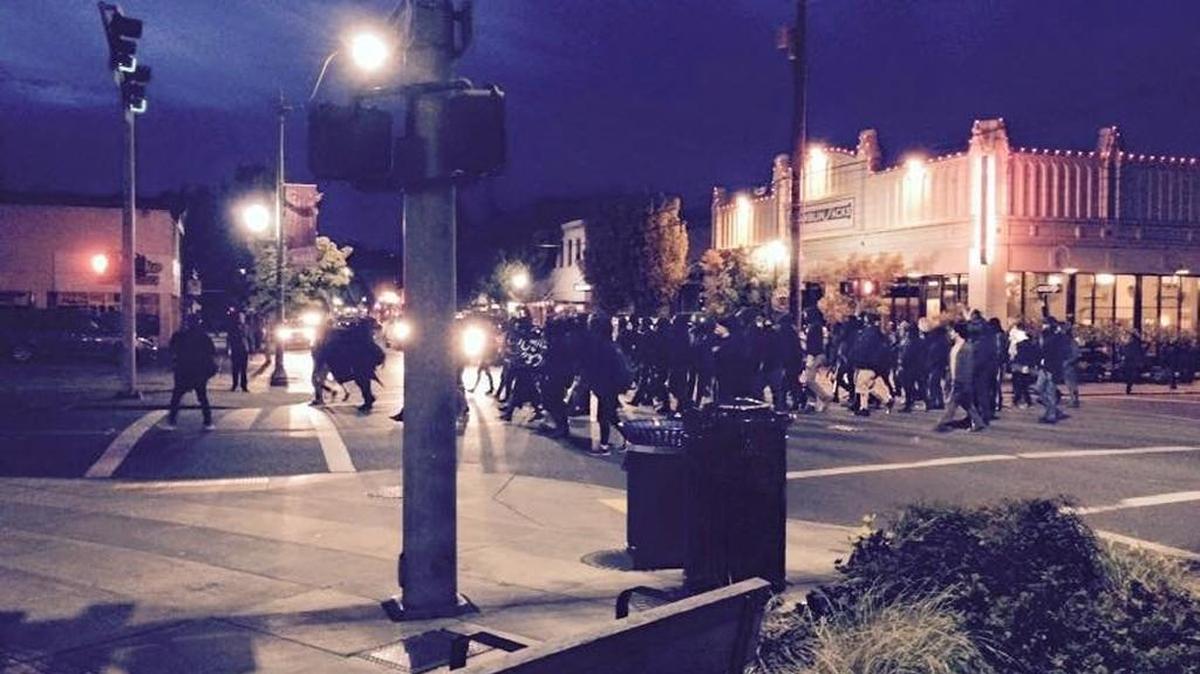 
About 100 demonstrators march past Olympia City Hall Saturday night.
