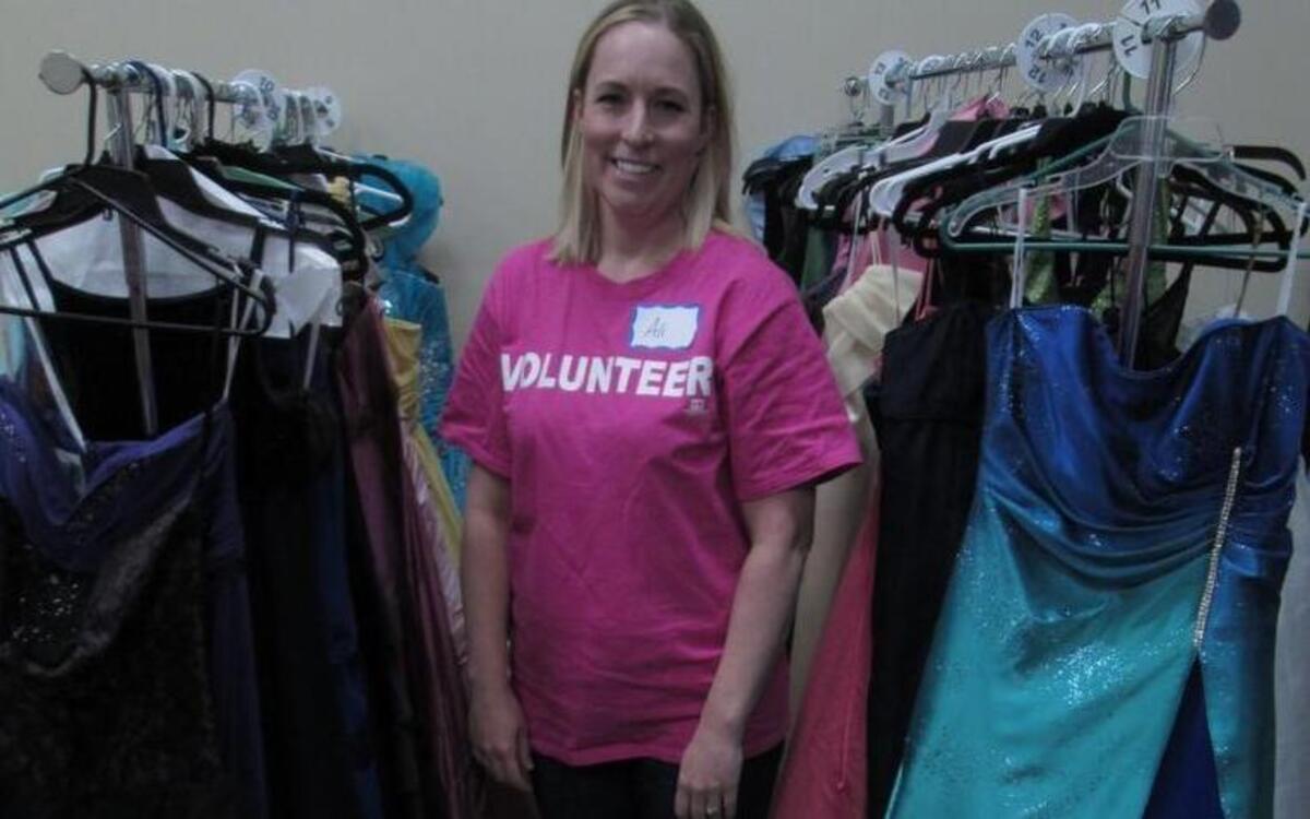 Alison Joseph of Gig Harbor started Ali’s Prom Project in November with a Facebook post that received 500 responses that day alone. She stands among some of the 700 dresses donated for girls in foster care to get to wear to prom.