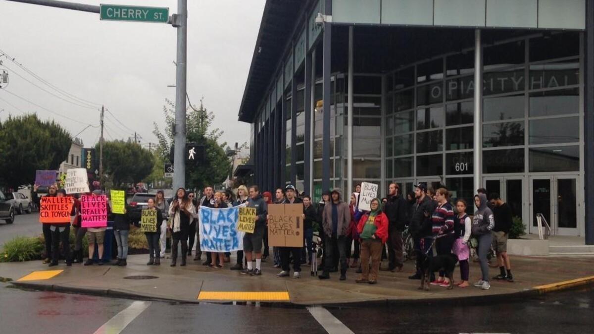 Protesters gathered outside Olympia City Hall Thursday evening to protest the recent shootings in Baton Rouge, Louisiana and St. Paul, Minnesota.