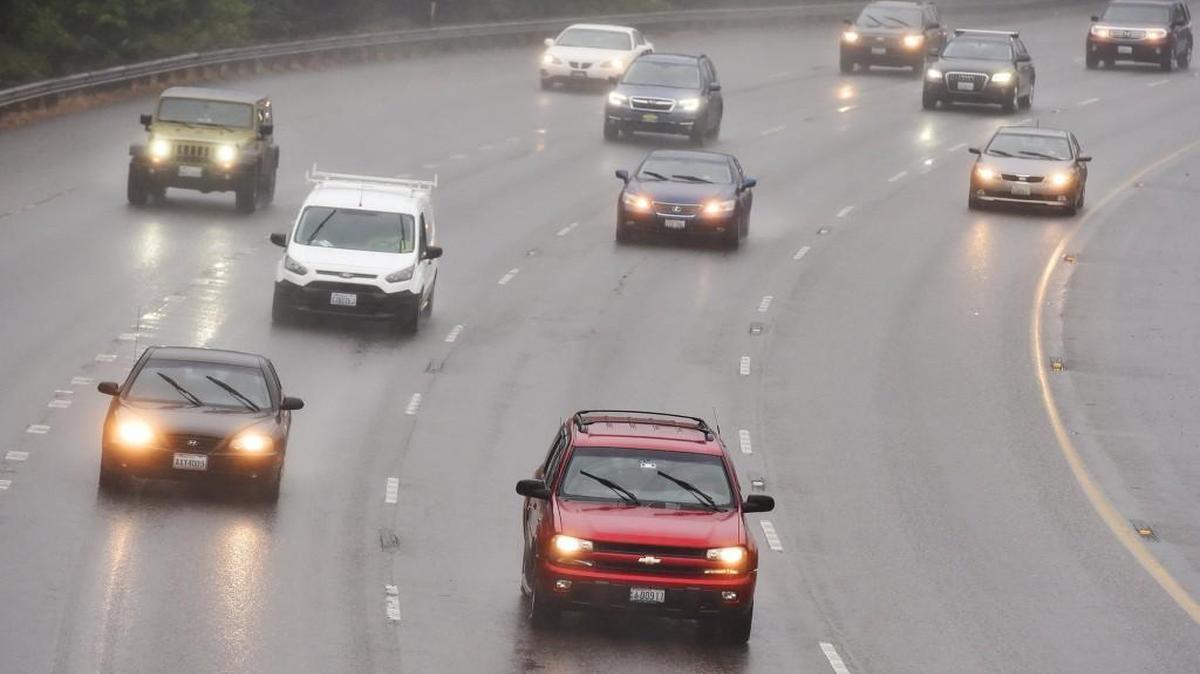 Commuters along Interstate 5 in Olympia in July 2017. The state has begun testing a plan that would raise revenue for road construction by charging motorists a fee tied to the number of miles they drive each year.