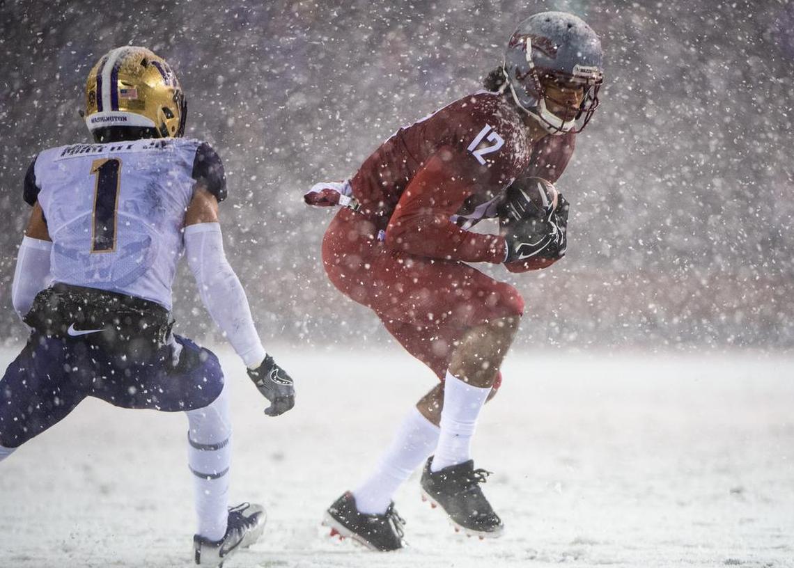 Washington State wide receiver Dezmon Patmon (12) makes a catch in the Apple Cup in Pullman in 2018. Patmon is expected to be selected later in this weekend’s NFL draft.