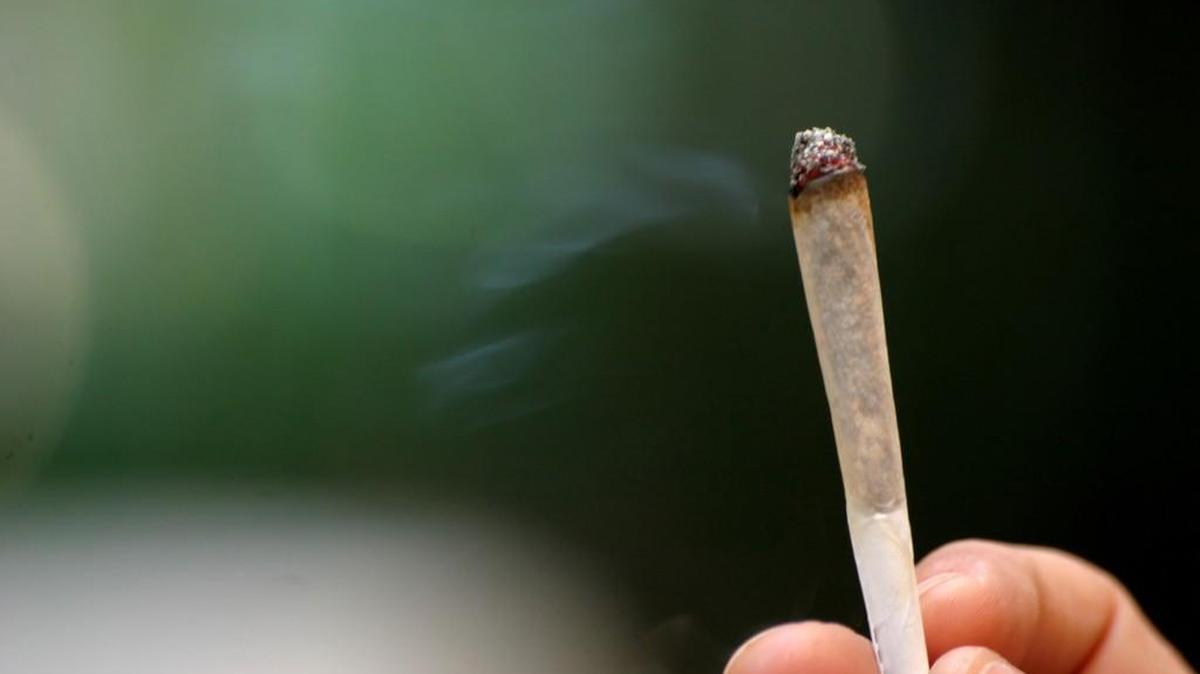 Dude, it is illegal to smoke pot while driving in the Evergreen State.
