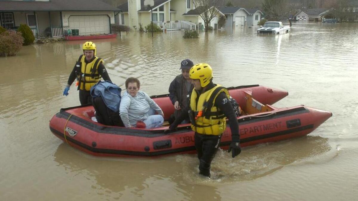 
In 2009, Carolyn Lovin and her husband, Larry, were rescued from their flooded home at White River Estates in Pacific by Valley Regional Fire Authority personnel Anthony Rodriguez and Ted Kocher. The flood occurred after an intentional release from Mud Mountain Dam sent the White River over its banks.
