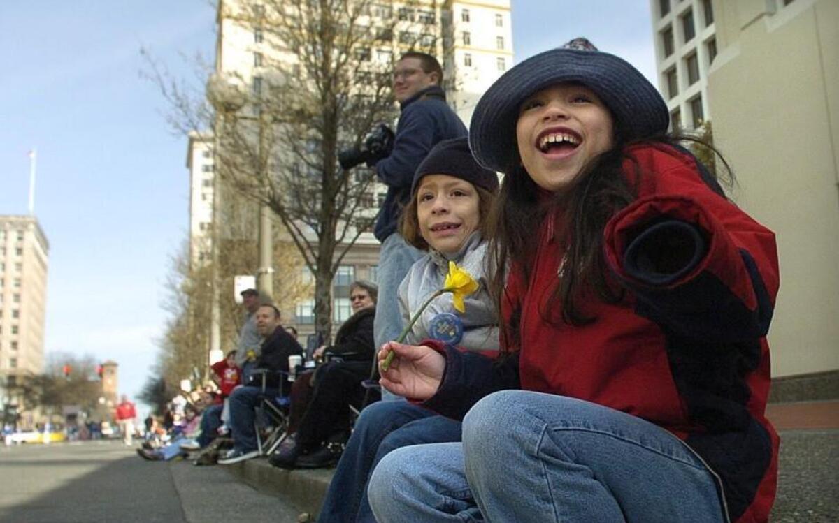 Sophie and sister Dani Collazo react to a cannon firing during the 2009 Daffodil Parade in Tacoma. A hearing expert says the Seafair Pirates’ cannon-boom noisemaker can contribute to permanent hearing damage.