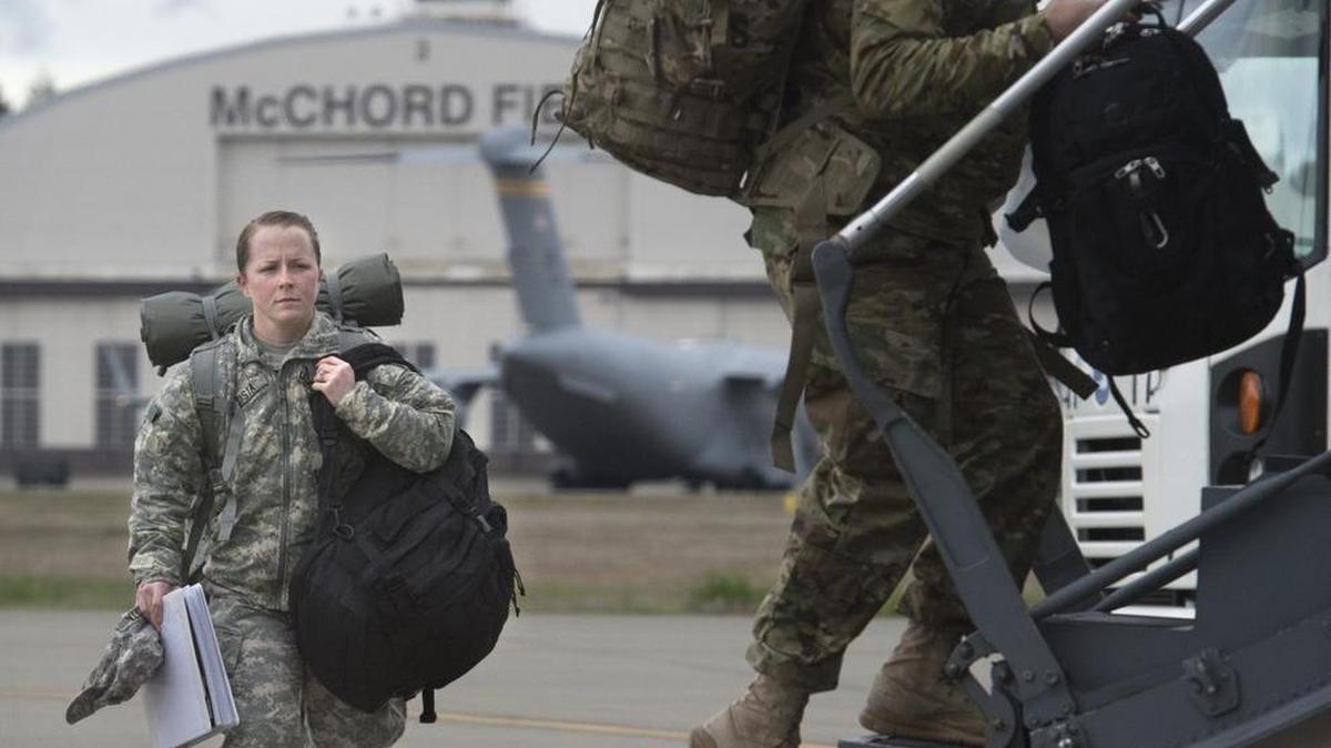 1st Corps soldiers load an Air Force C-17 transport jet March 23 at Joint Base Lewis-McChord. President Donald Trump’s freeze on hiring federal workers does not apply to uniformed military personnel.