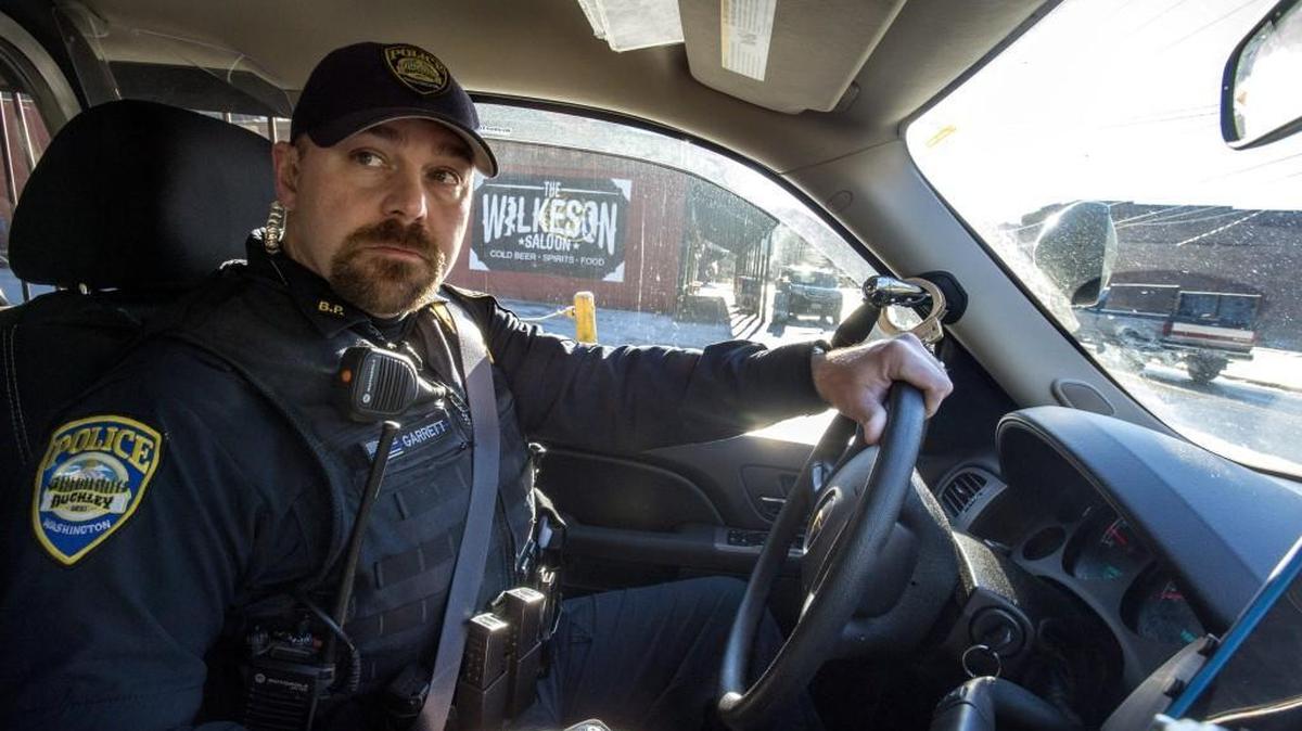 Buckley Police Detective Adam Garrett patrols in Wilkeson, Dec. 6, 2016. Wilkeson and Carbonado found it advantageous to contract with Buckley for police services. Many municipalities around Pierce County are setting up shared operations to keep services working with lower costs.