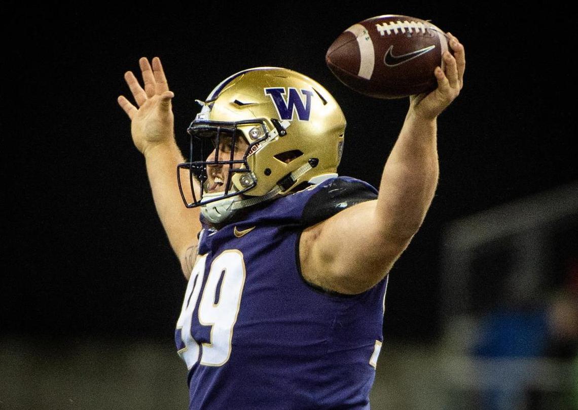 Washington defensive lineman Greg Gaines celebrates his interception in the second quarter. The Washington Huskies played the Stanford Cardinal in a NCAA football game at Husky Stadium in Seattle, Wash., on Saturday, Nov. 3, 2018.