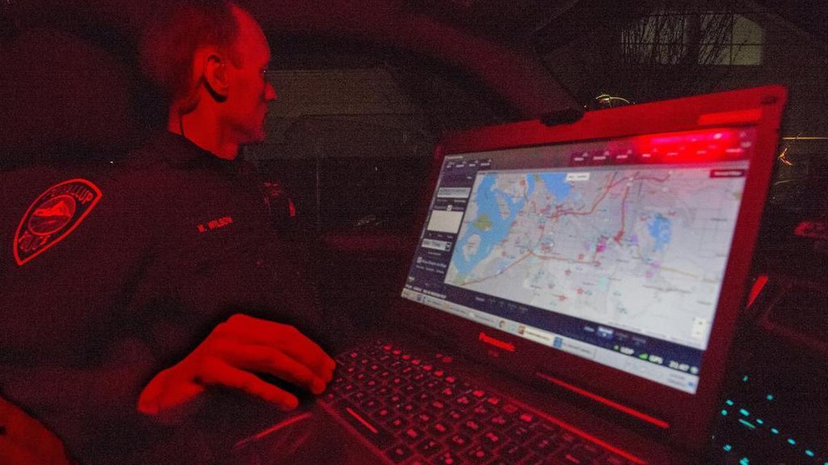 Puyallup police officer Micah Wilson uses the new Intergraph computer aided dispatching system.