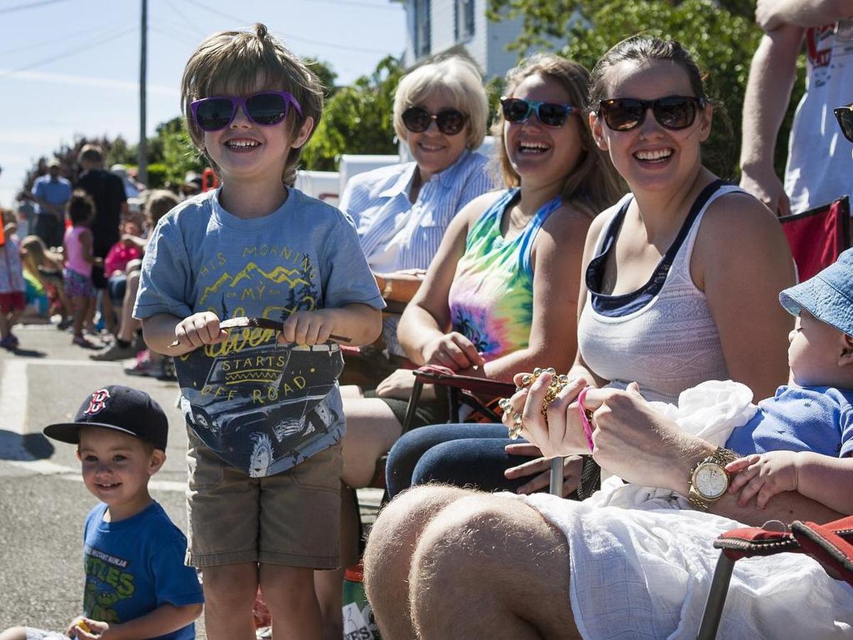Onlookers, including Oliver Ladd, left, watch the Yo’ Ho’ Harbor Grande Parade in Gig Harbor, Wash., on Saturday, June 4, 2016.