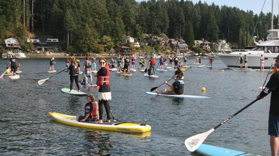 Inaugural SUP in the Harbor event unites community, brings awareness for funding for schools