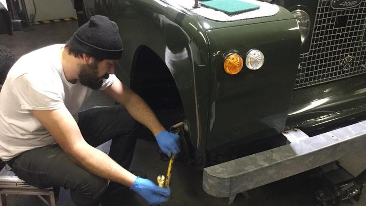Defenders Northwest customer Nathan Napolitano works on changing the brake cylinders and seals on his 1966 Series IIA Land Rover at the company’s Gig Harbor workshop.