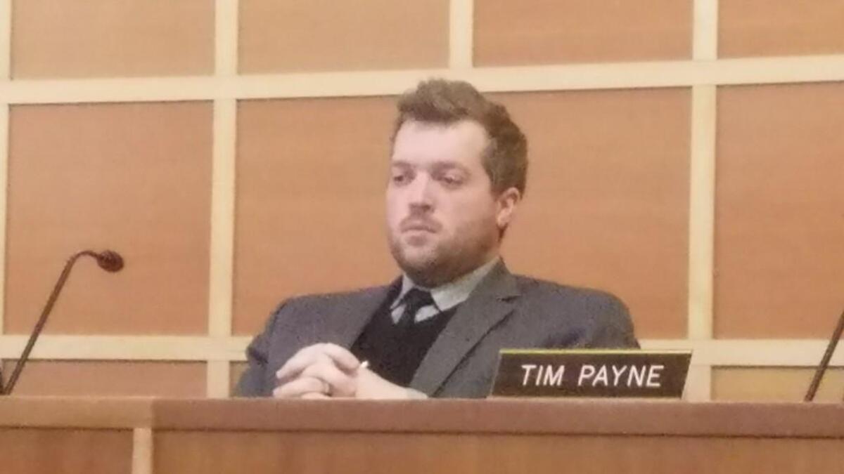 Spencer Hutchins sits and listens to public comments during the Dec. 19 Gig Harbor City Council meeting