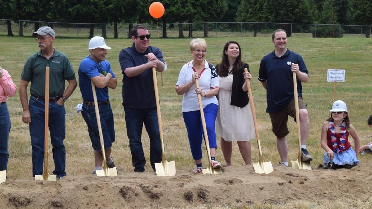 Representatives Jan Angel, Michelle Caldier and Jesse Young, along with Pierce County Councilmember Derek Young and Parks Commissioners, participate in the ceremonial groundbreaking ceremony for Key Pen Parks Gateway Park on July 4.