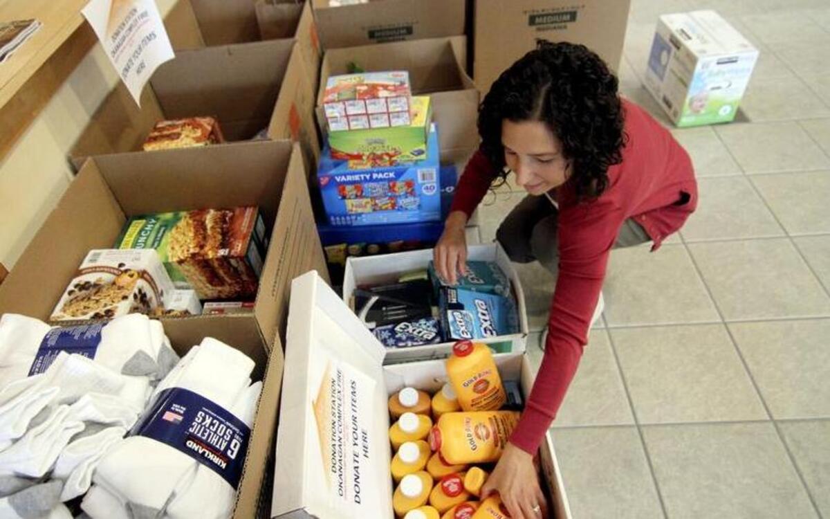 
City of Gig Harbor Municipal Court Clerk Sarah Neighbors readies donated supplies that were set to be transported to the front lines of the wildfire in eastern Washington on Friday. Donated items included non-perishable food, new socks, baby wipes and many other useful supplies for weary fire crews.
