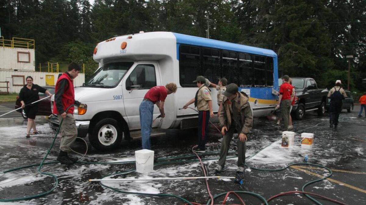No job was too big Saturday for a team of Boy Scout Troop 220 supporters whose car washers even took on a bus to recover funds for their summer camp plans.