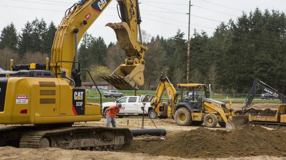 Crews from Bob Pearson Construction Inc. work on grading the site of Gateway Park on the Key Peninsula on April 4. Phase one of the park is expected to be completed by Sept. 30.