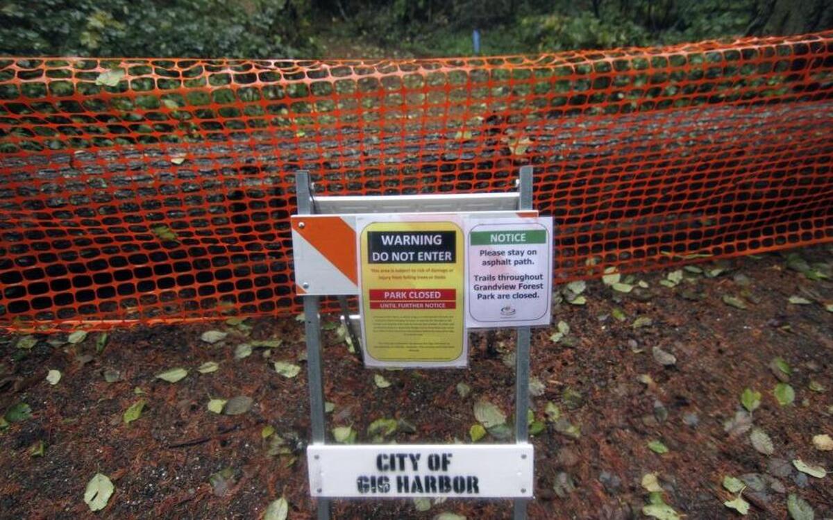 Warning barricades indicate the closure of Grandview Forest Park due to several trees with diseased roots that could cause the timber to fall.