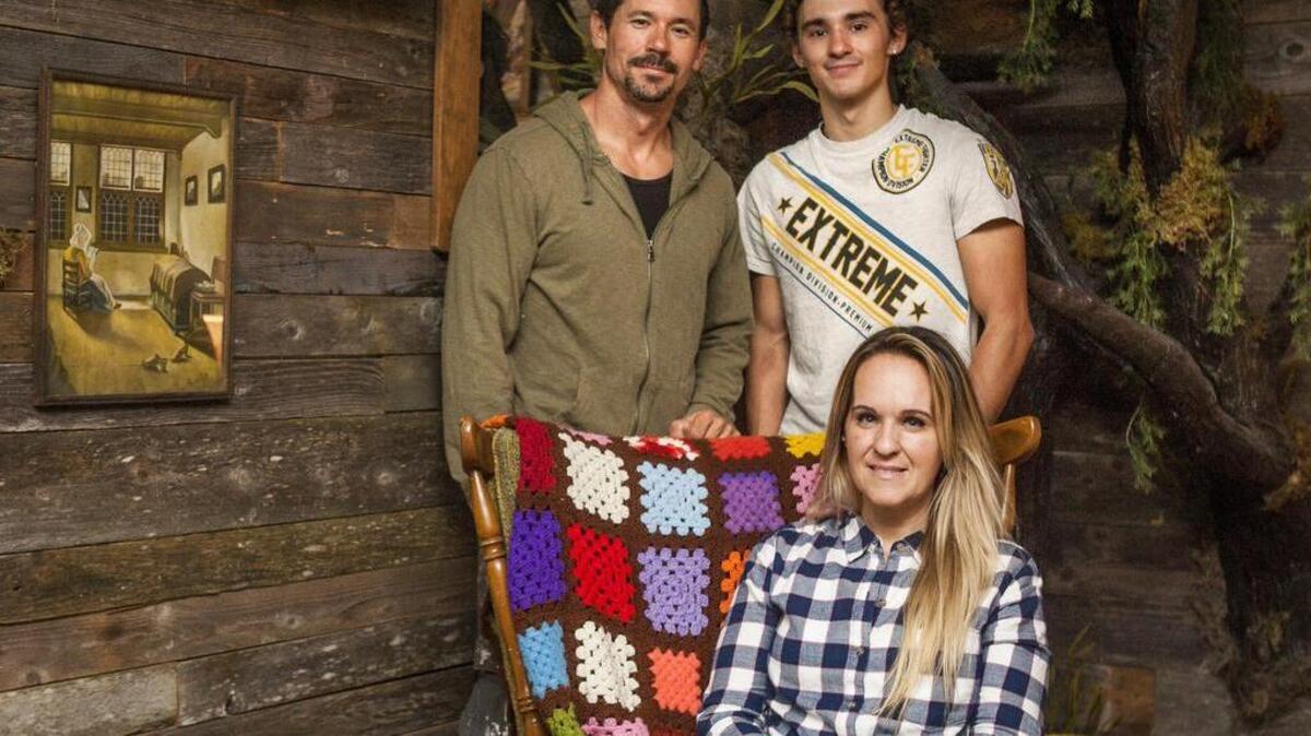 Clockwise from left: Matt Matteson, Tyler Matteson and Kelsy Matteson sit for a portrait inside one of the rooms at Escape Room in Gig Harbor. Escape Room is a puzzle-based challenge that features different rooms that guests have to escape from in an hour.