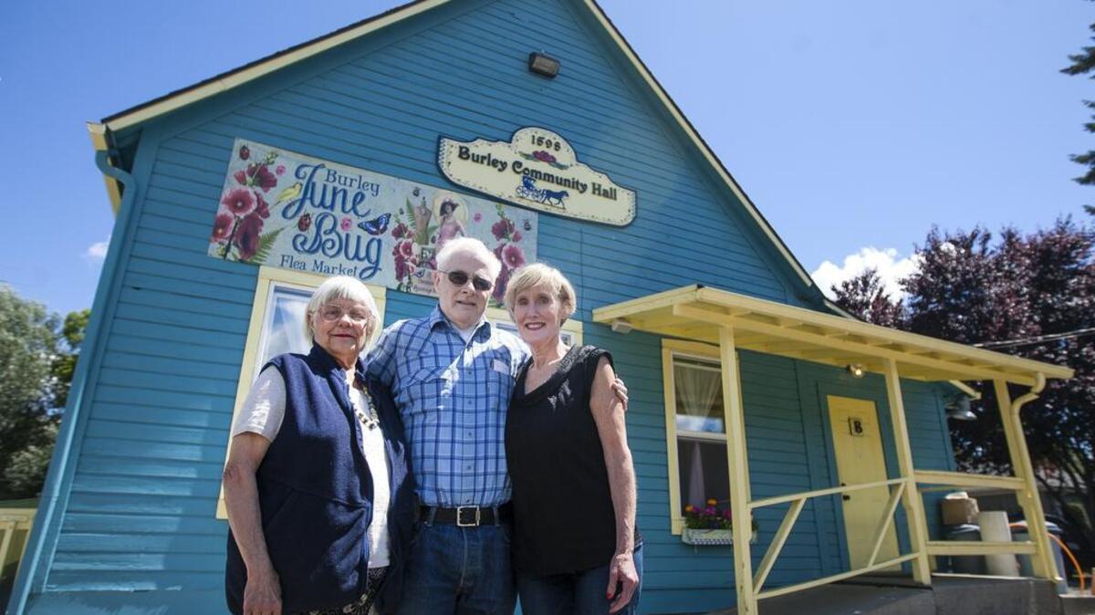 Heather McFarlane, president of Friends of Burley Lagoon, left, George King, president of the Burley Community Club, center, and Jane Buchanan, head of the Burley Events Group, stand outside the Burley Community Hall in Burley on Thursday.