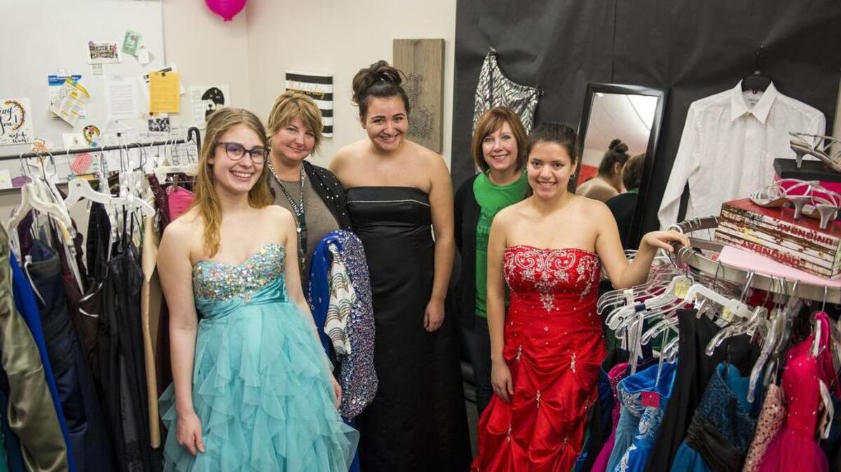 From left: Anna Marshall, Wendy Wojtanowicz, Michelle Tudor, Karen Ramirez and Christin Donaldson get together at the Prom Boutique at Peninsula High School. Marshall, Tudor and Donaldson are all wearing dresses they found at the boutique.