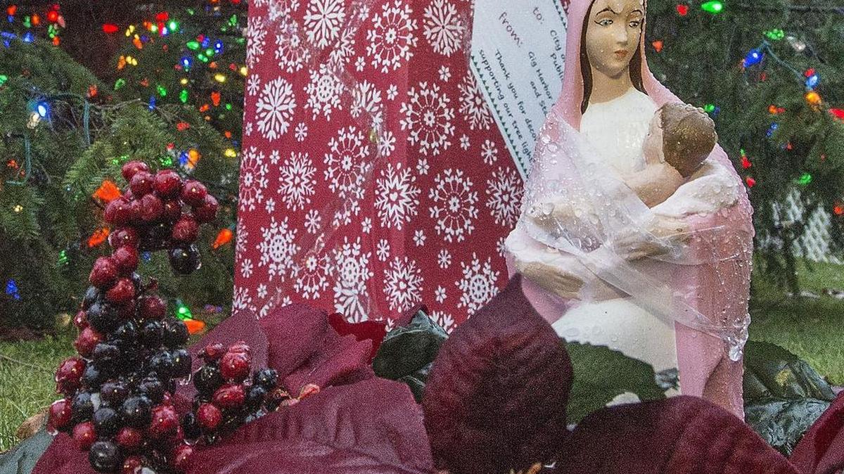 A small statue of the Virgin Mary and baby Jesus sit in front of the city of Gig Harbor’s Christmas tree at Donkey Creek Park last December. Gig Harbor Marina & Boatyard announced last week that it would proudly host the donated Nativity scene from resident John Skansi for placement along Harborview Drive during the month of December.
