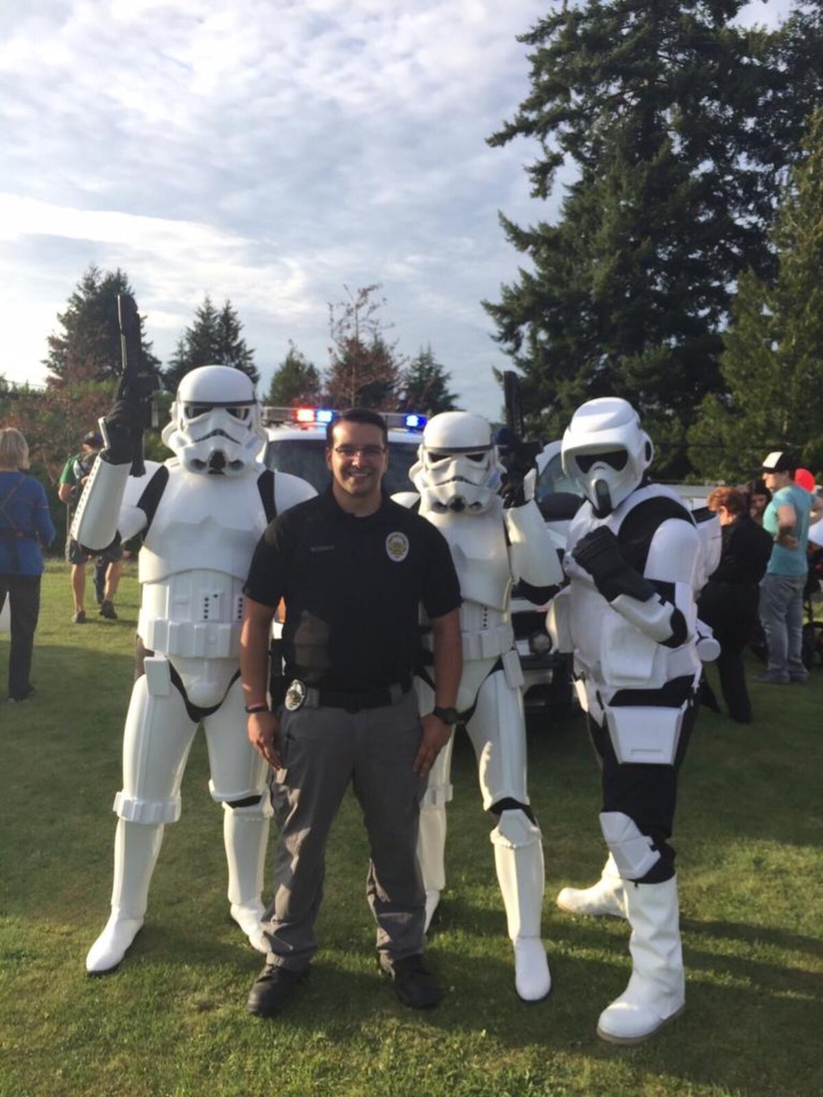 Gig Harbor police Community Service Officer Adam Blodgett stands with storm troopers during 2016’s National Night Out.