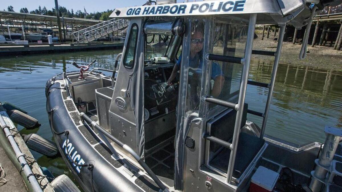 Sgt. Matt Dougil stands on the Gig Harbor Police Department’s 21-foot-long SAFE Boat in Gig Harbor on Sunday.