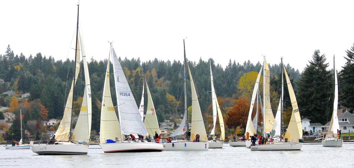 Gig Harbor Yacht Club’s LeMans race starts at anchor with crews below deck. When the gun sounds, crews rush to simultaneously hoist the sails, pull up anchors and all sail out of the narrow Harbor mouth and up to Olalla and back.