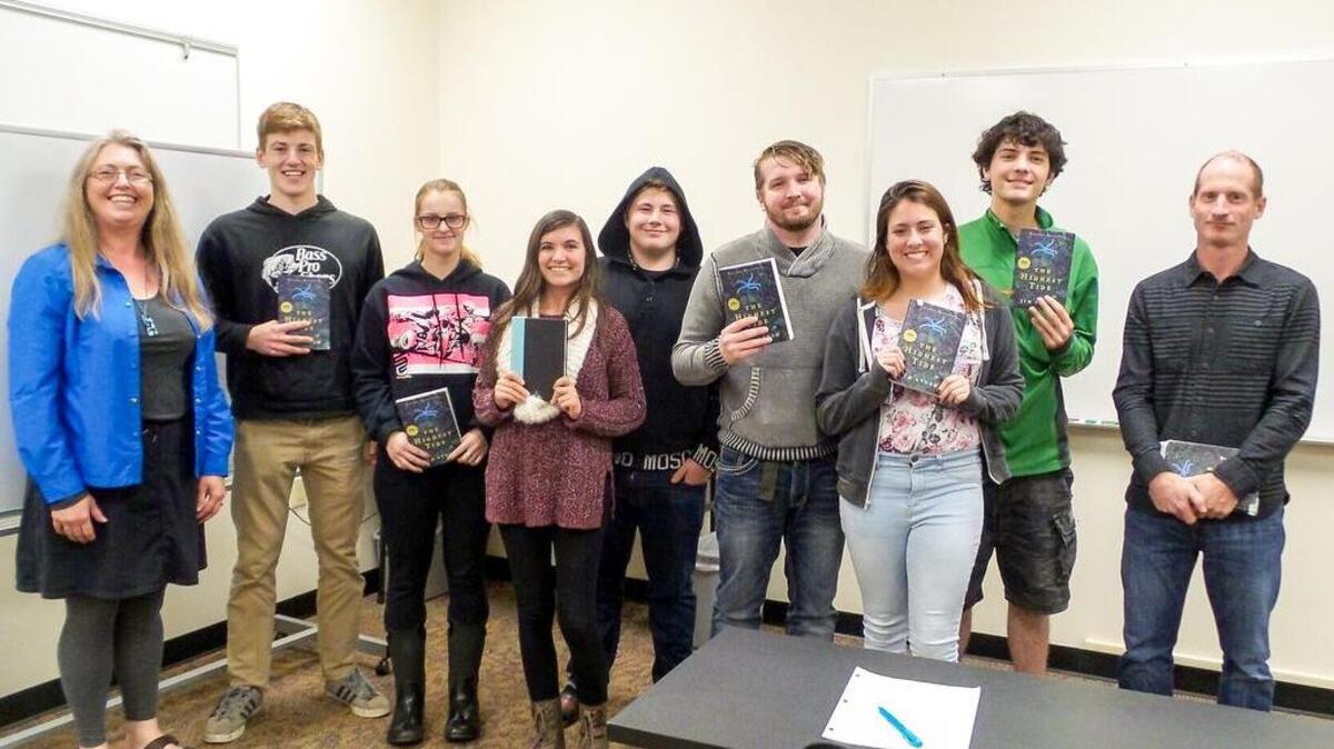 Pacific Northwest author Jim Lynch, right, discusses his novel “The Highest Tide” with a Developmental Studies class at Tacoma Community College. Lynch was the keynote speaker at the 2016 Write in the Harbor conference over the weekend.