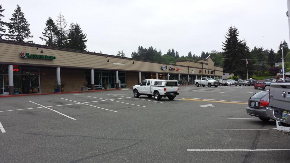 Olympic Property Group unveiled three different plans for development of the Peninsula Shopping Center during a presentation Wednesday night at the Inn at Gig Harbor. Each plan features a different mix of residential, commercial and public-use options for the site.