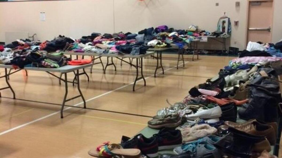 Clothes, shoes, jackets and sweatshirts fill tables at Evergreen Elementary’s annual Clothing Exchange.