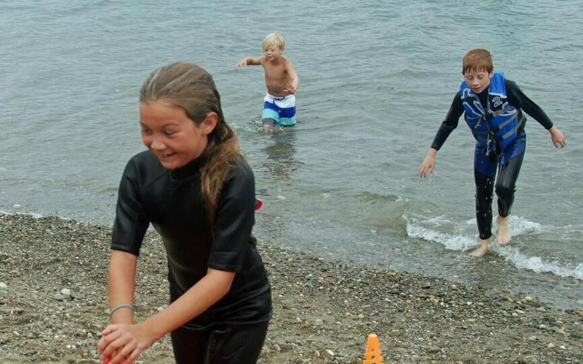 Hannah Welch finishes in second place in the Kids Swim at the 2015 Swim with Fish fundraiser.