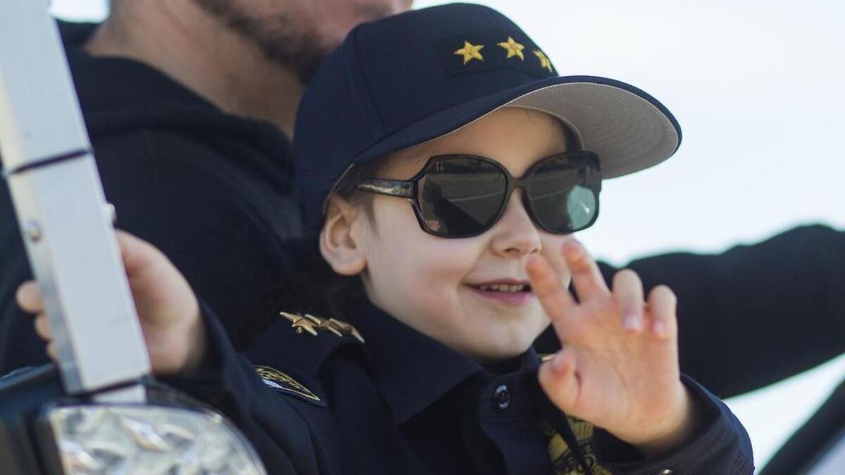 Gig Harbor Police Chief for a Day Violet Spataro waves to the crowd during the Yo’ Ho’ Harbor Grande Parade in Gig Harbor on Saturday.